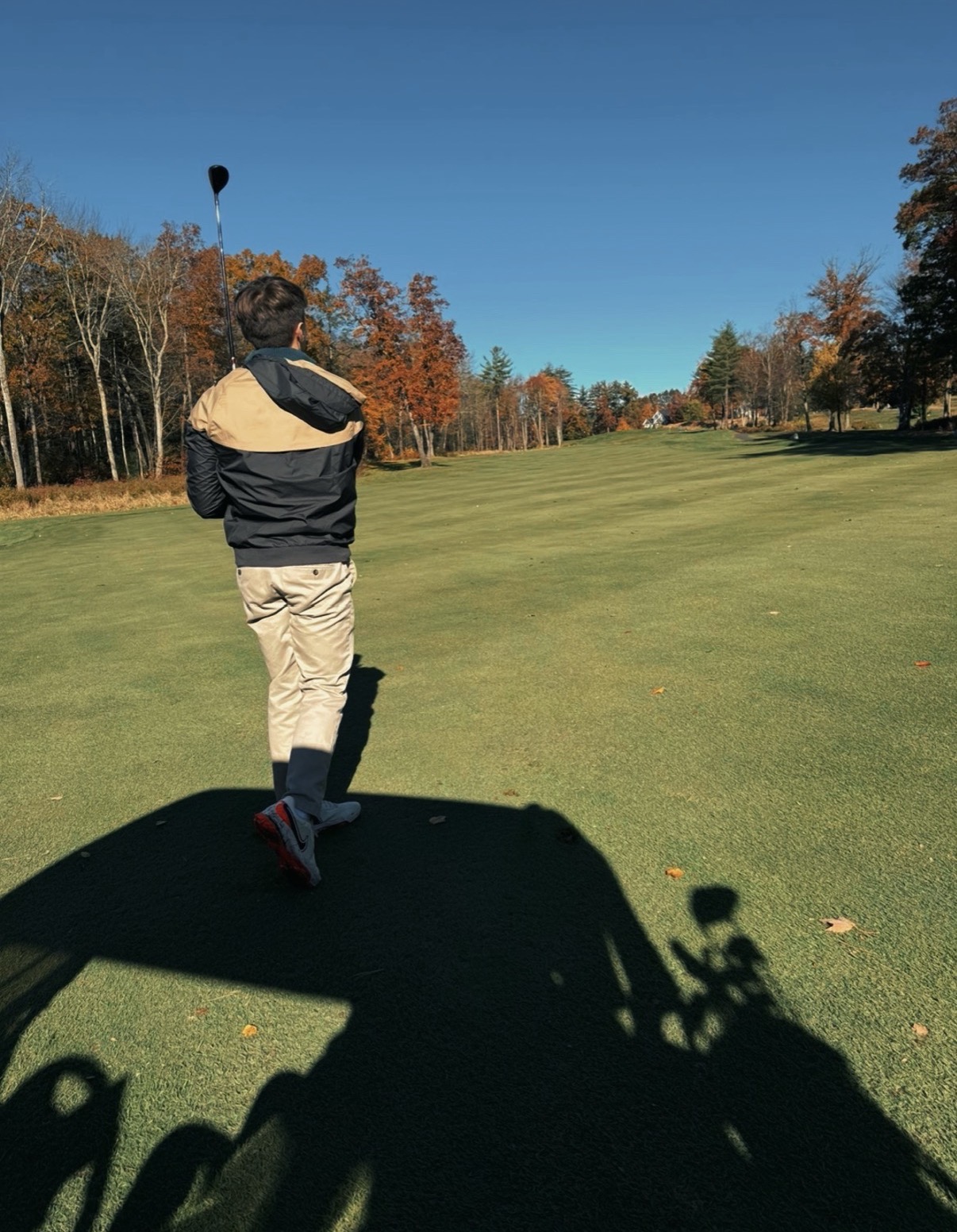 Steven watching his drive down an autumn fairway