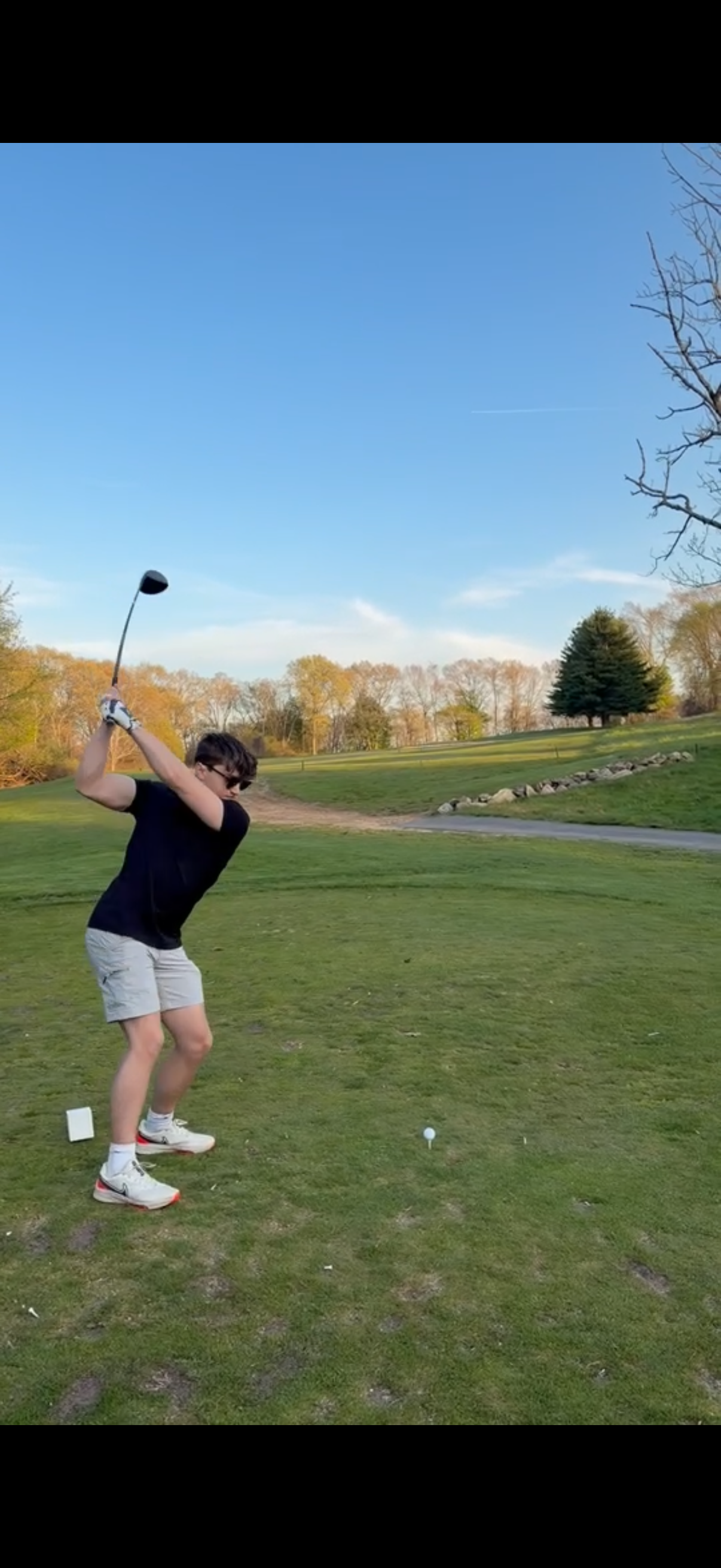 Steven mid-backswing with a driver